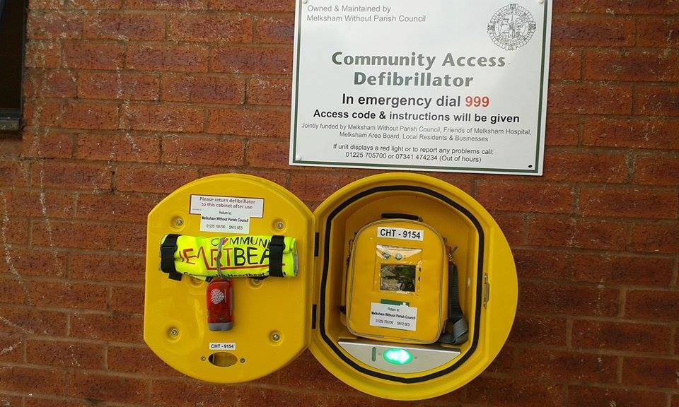 Photo of defibrillator inside of cabinet